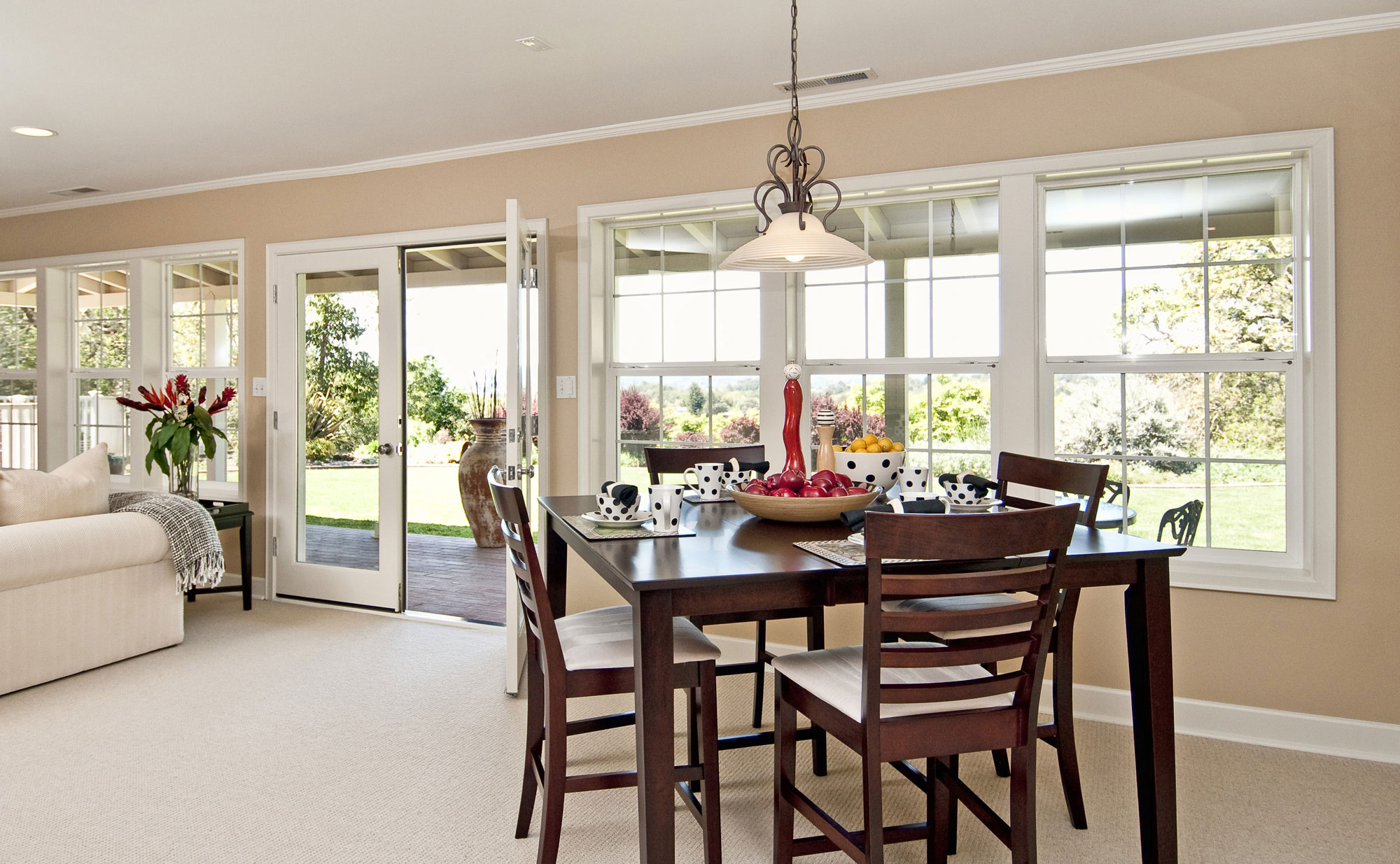 dining table in front of colonial grid windows 